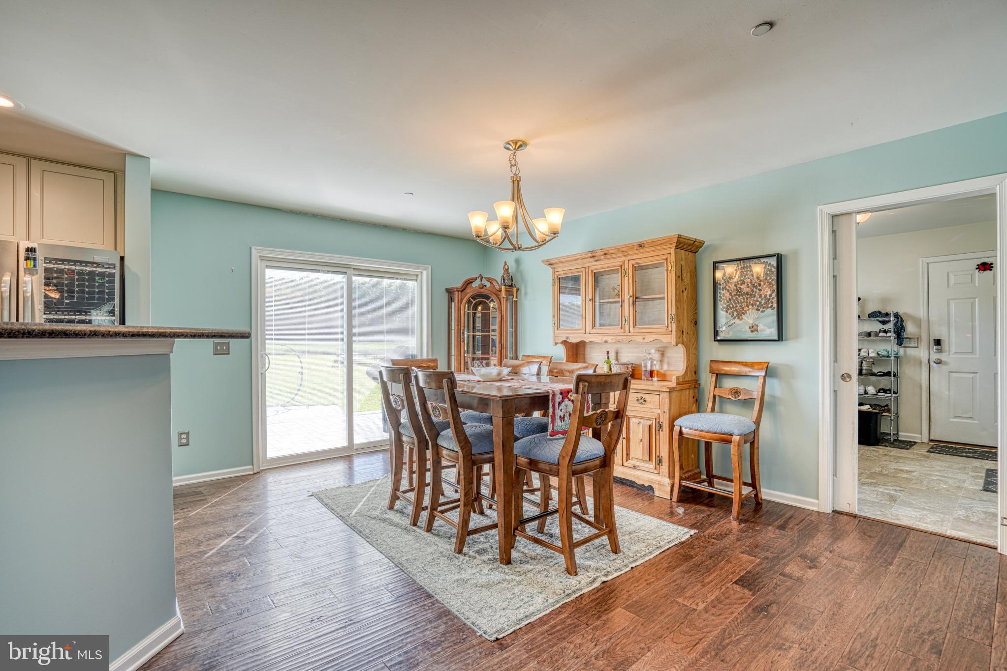 29862 Paddock Lane Easton, MD 21601 - Photo 28 of 83 a view of a dining room with furniture and wooden floor