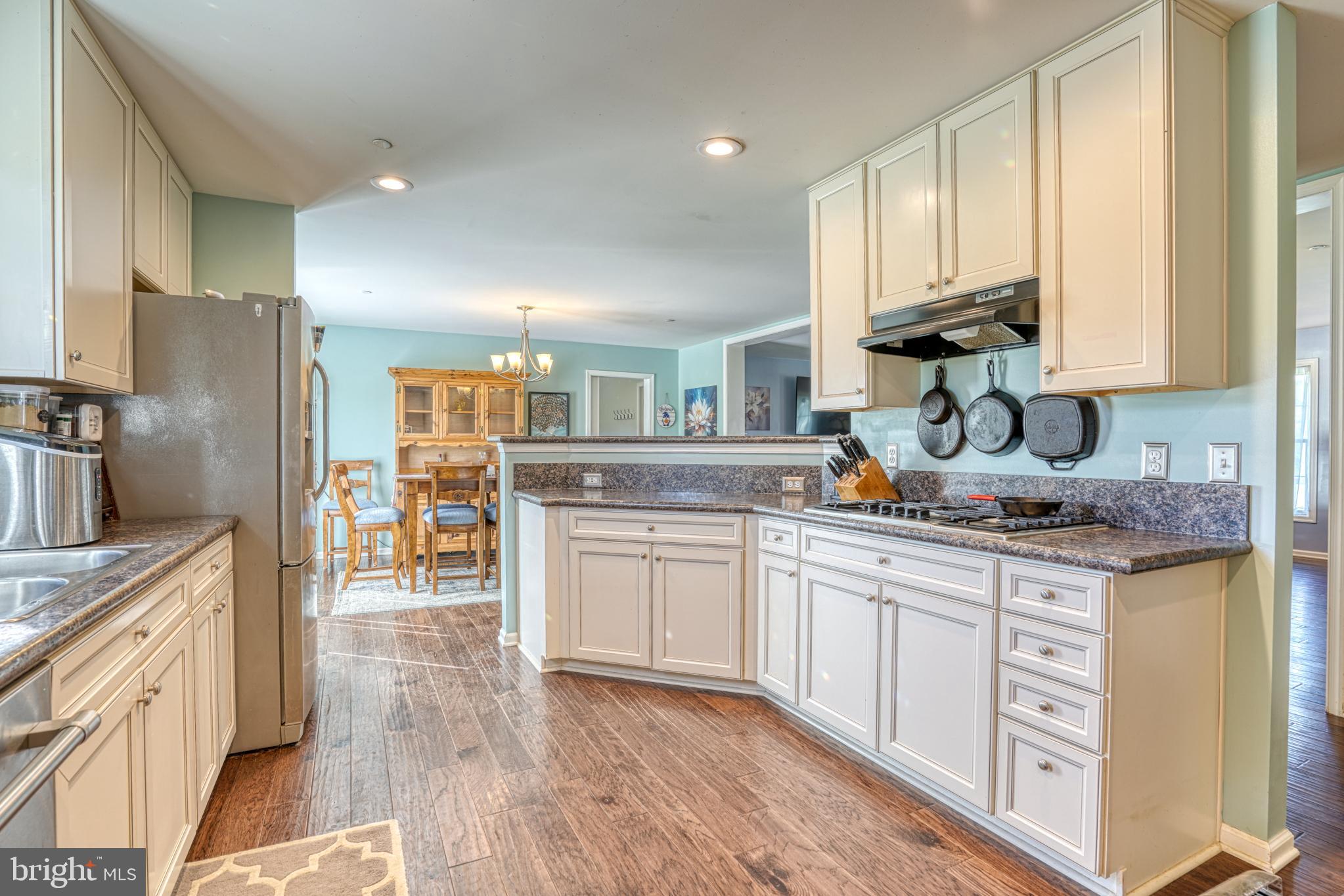 29862 Paddock Lane Easton, MD 21601 - Photo 33 of 83 a kitchen with stainless steel appliances granite countertop a sink and cabinets