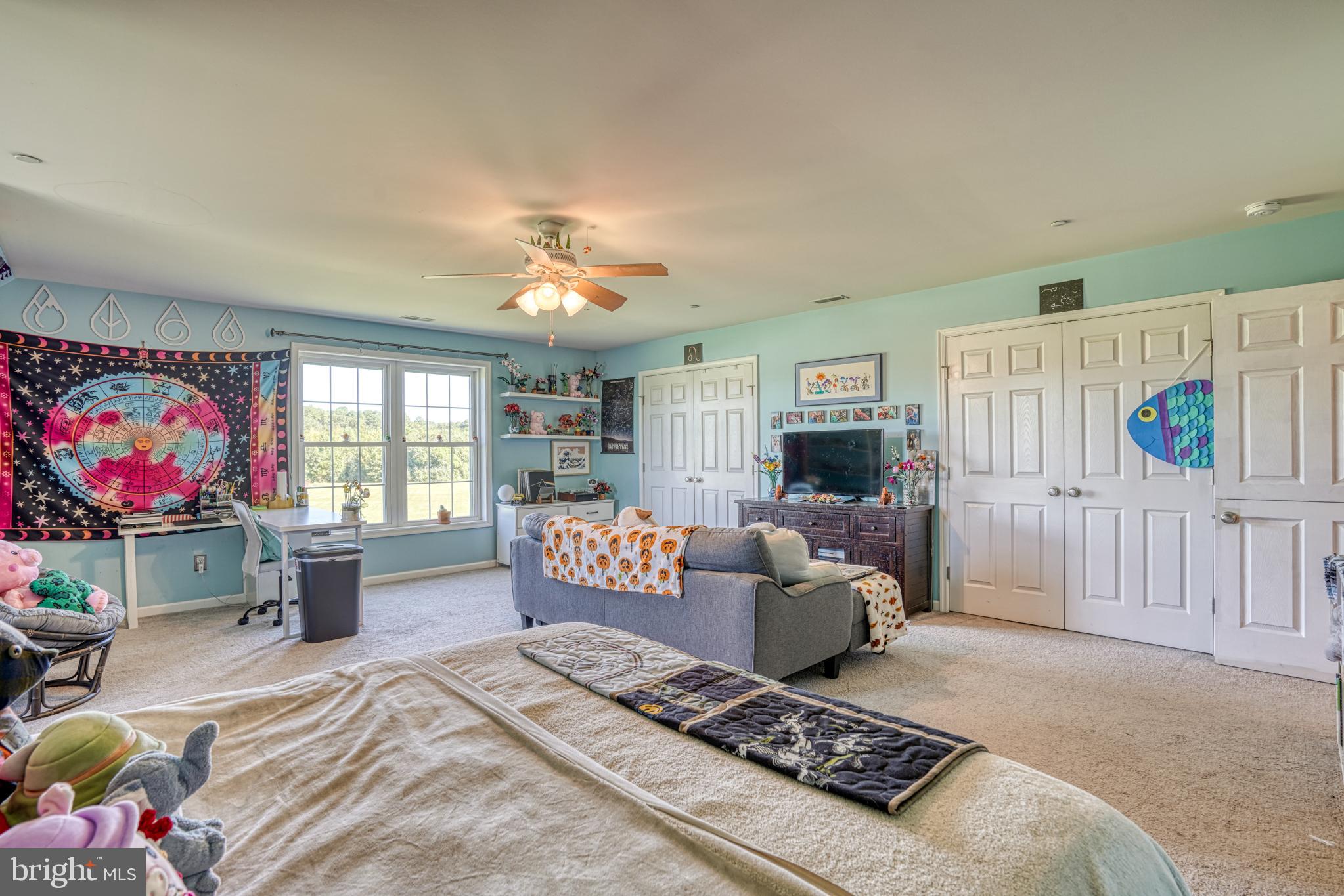 29862 Paddock Lane Easton, MD 21601 - Photo 57 of 83 a living room with furniture and a flat screen tv