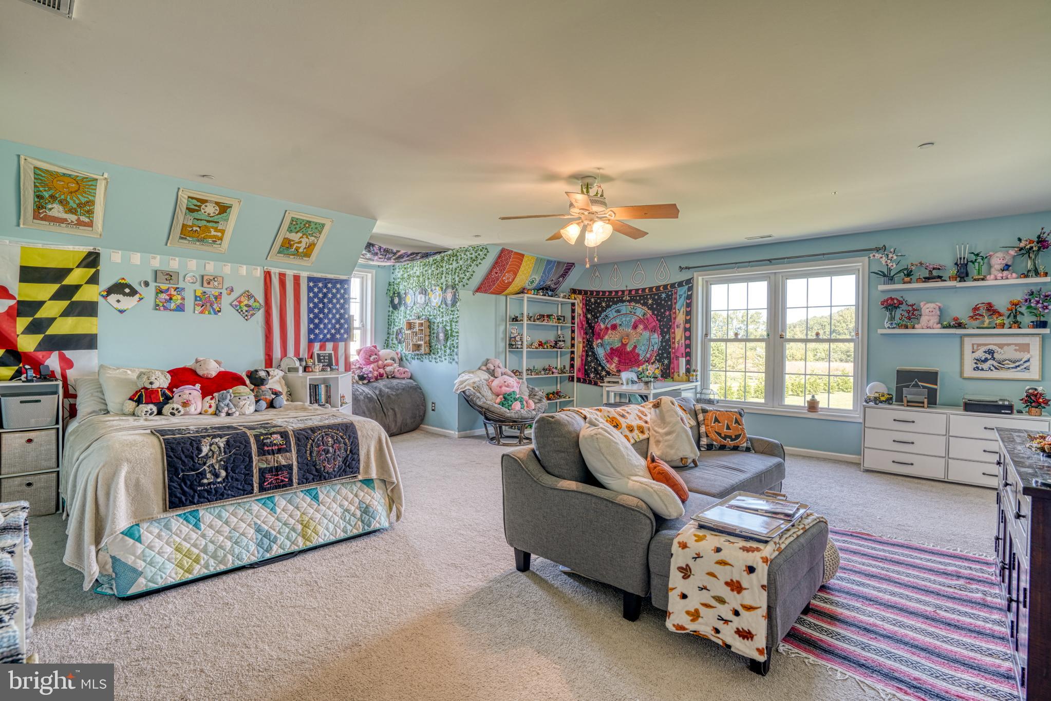 29862 Paddock Lane Easton, MD 21601 - Photo 60 of 83 a living room with furniture and a chandelier