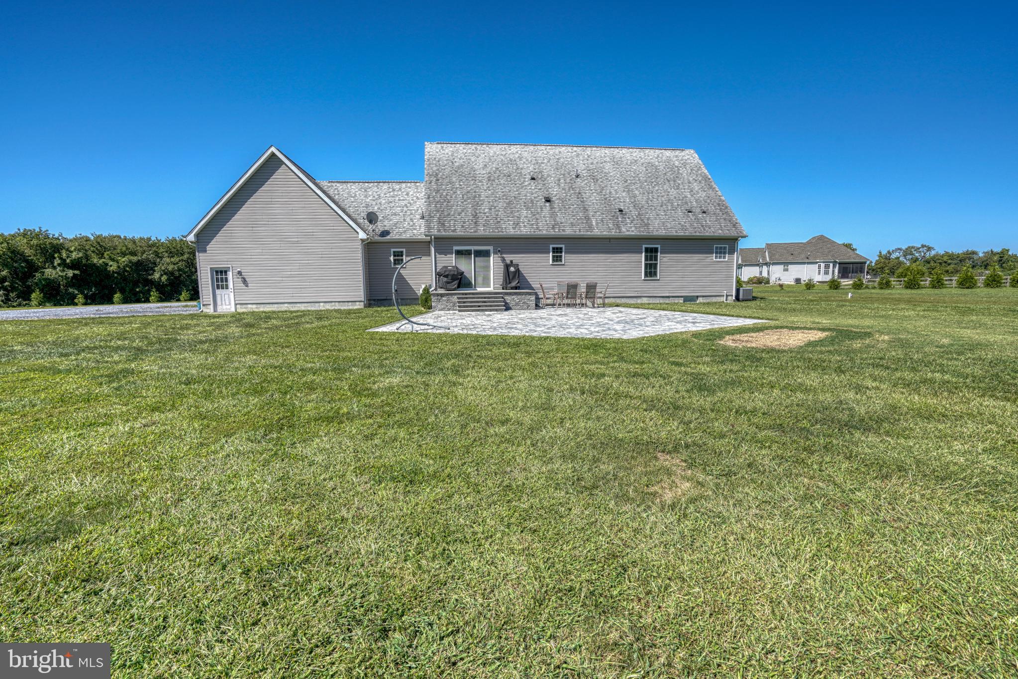 29862 Paddock Lane Easton, MD 21601 - Photo 65 of 83 a view of a house with a yard and sitting area
