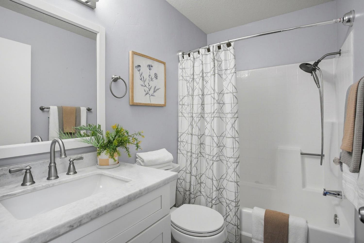 11150 Trinity River Drive, Unit 124 Rancho Cordova, CA 95670 - Photo 21 of 29 Hall bathroom / tub with shower over and newer shower heads, granite countertop, faucets.