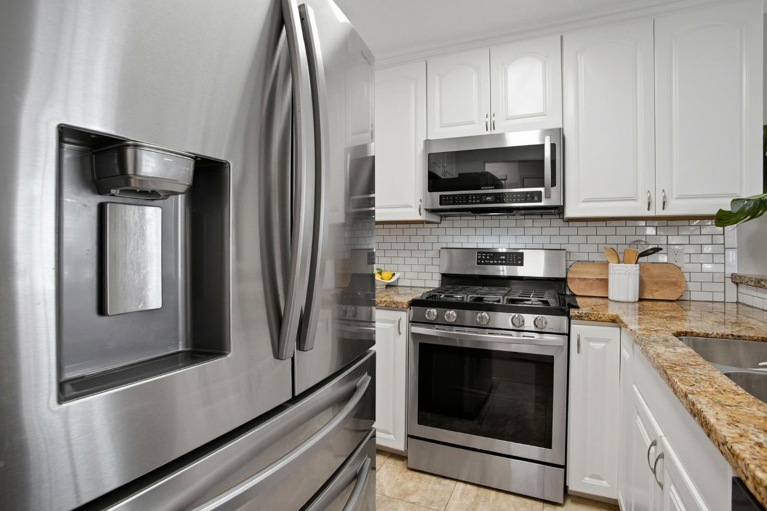 11150 Trinity River Drive, Unit 124 Rancho Cordova, CA 95670 - Photo 10 of 29 Kitchen with fresh flooring, fully equipped with quality stainless steel appliances (all included).