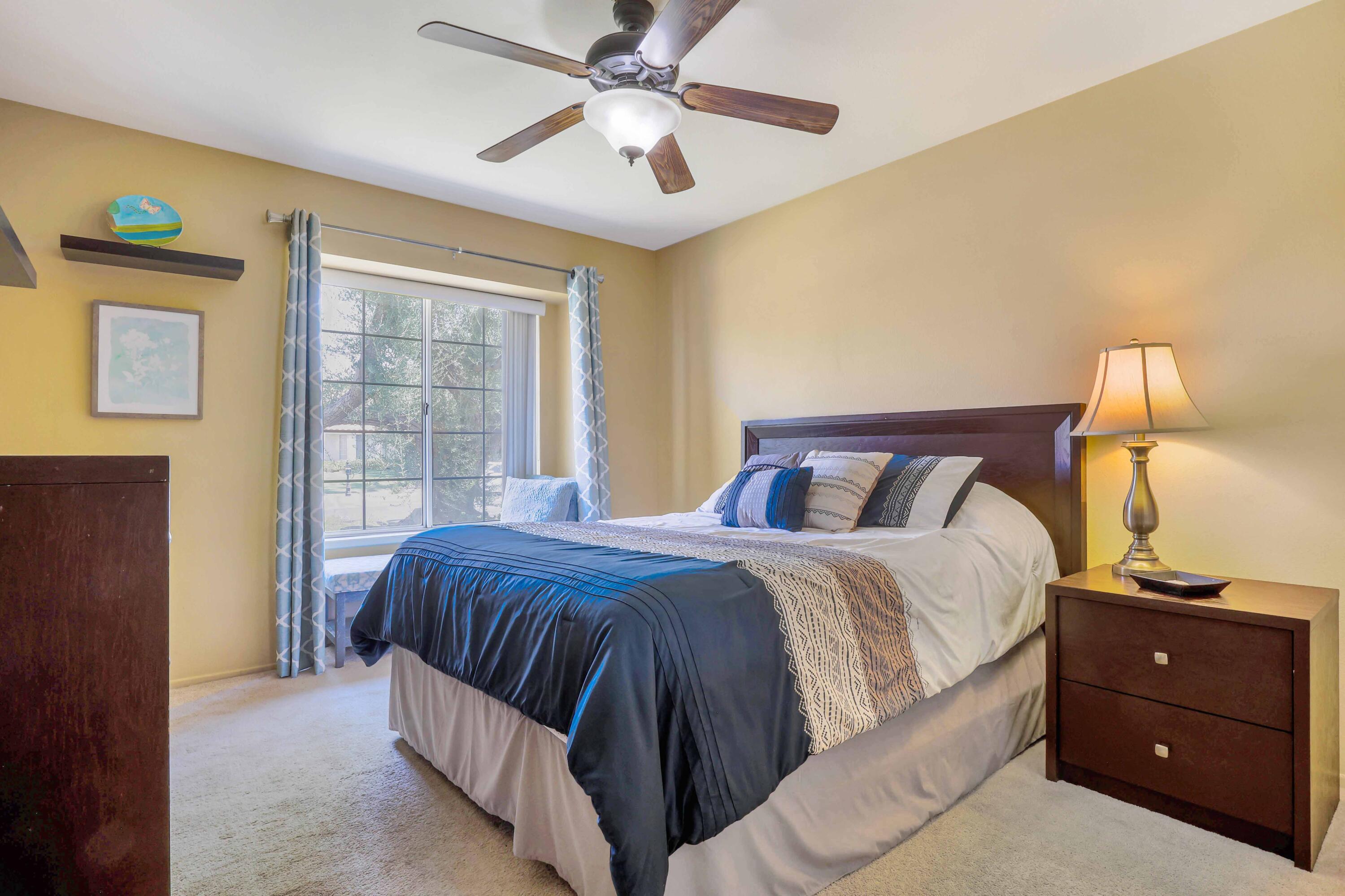 39795 Regency Way Palm Desert, CA 92211 - Photo 19 of 25 a bedroom with a bed and a window