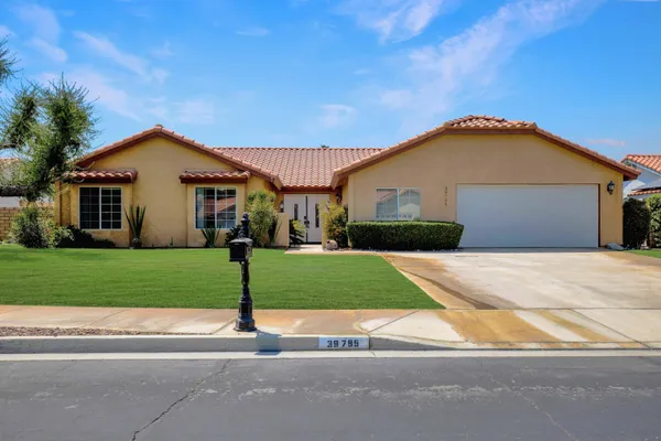 a kitchen with stainless steel appliances kitchen island granite countertop a table and chairs