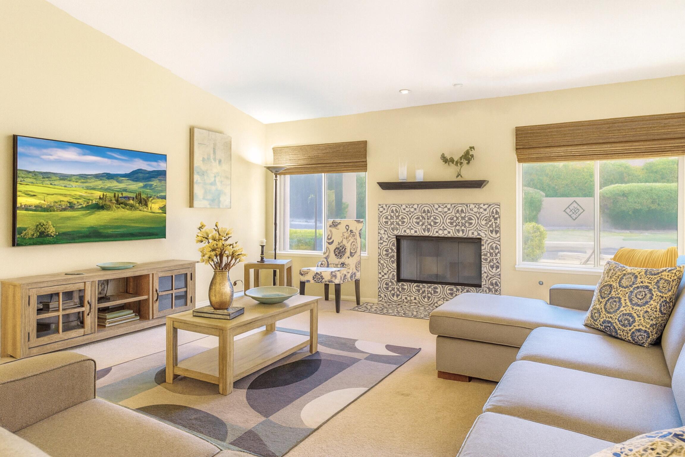 39795 Regency Way Palm Desert, CA 92211 - Photo 6 of 25 a living room with furniture fireplace and flat screen tv
