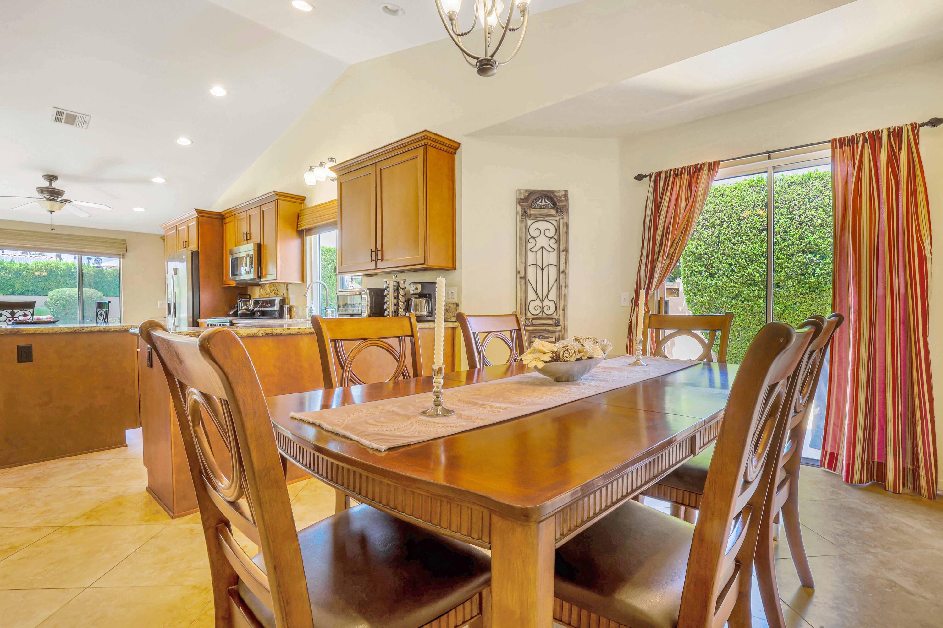 39795 Regency Way Palm Desert, CA 92211 - Photo 10 of 25 a view of a dining room with furniture window and outside view