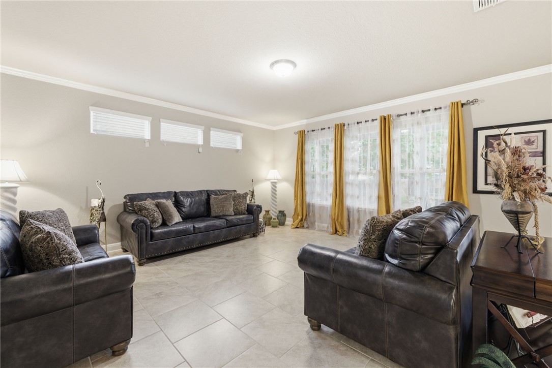 8826 Virginia Rye San Antonio, TX 78254 - Photo 11 of 40 a living room with furniture and a large window