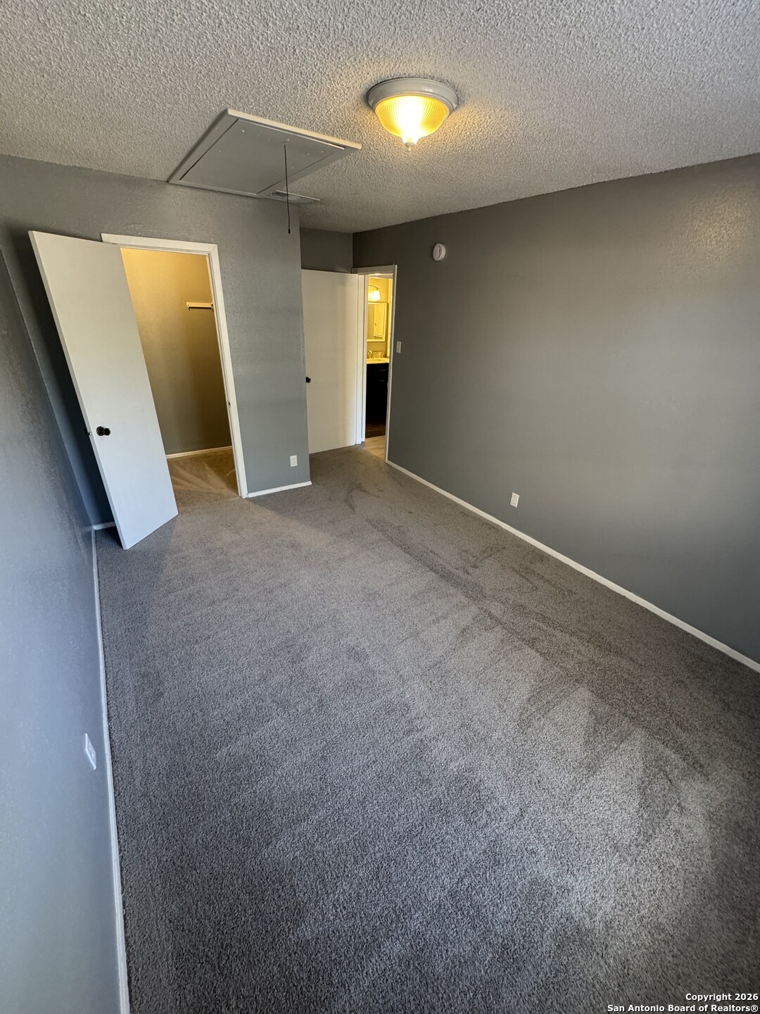 5019 Concord Ridge San Antonio, TX 78228 - Photo 11 of 19 an empty room with windows and bathroom
