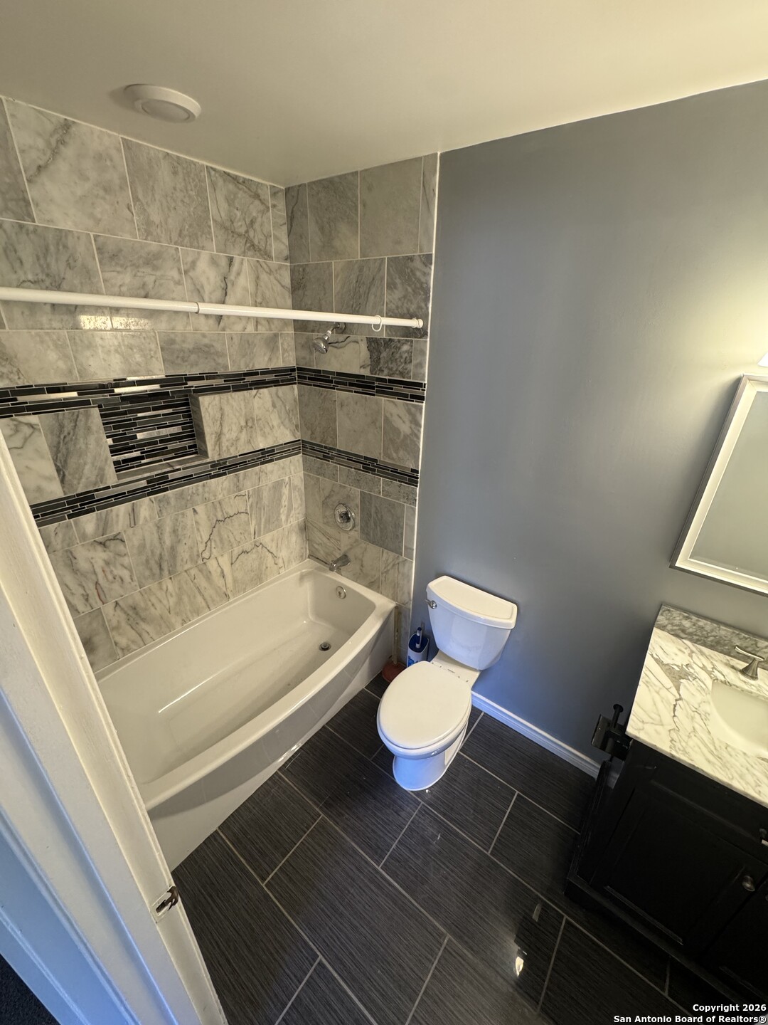 5019 Concord Ridge San Antonio, TX 78228 - Photo 13 of 19 a bathroom with a sink and a mirror