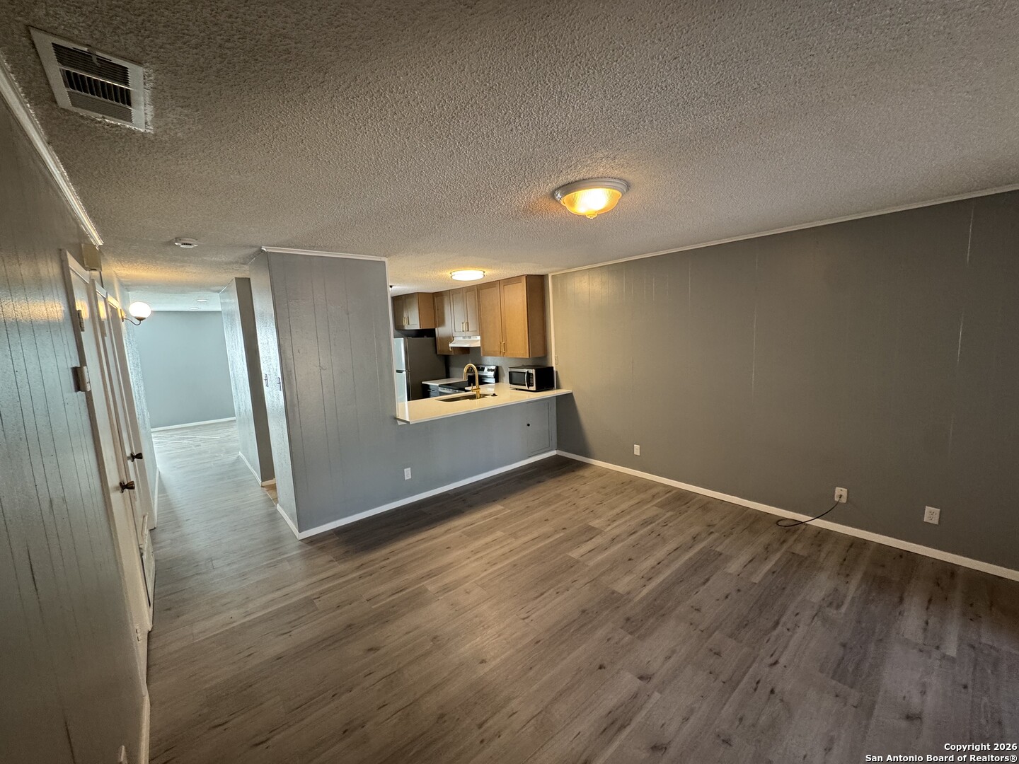5019 Concord Ridge San Antonio, TX 78228 - Photo 6 of 19 a view of a kitchen with a sink and refrigerator