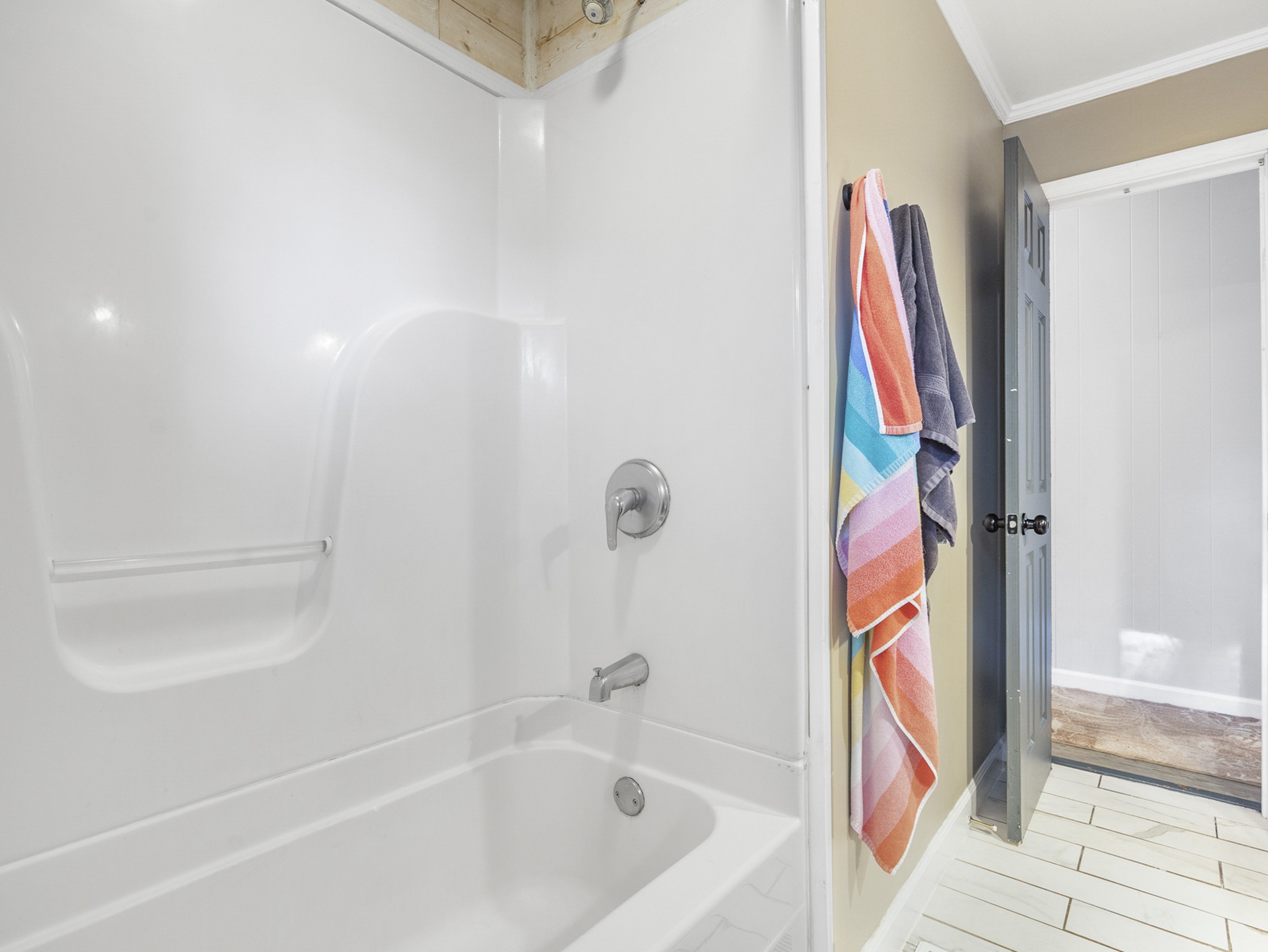 2502 Sullivan Knowles Road Sparta, TN 38583 - Photo 15 of 45 a bathroom with a bathtub and a shower
