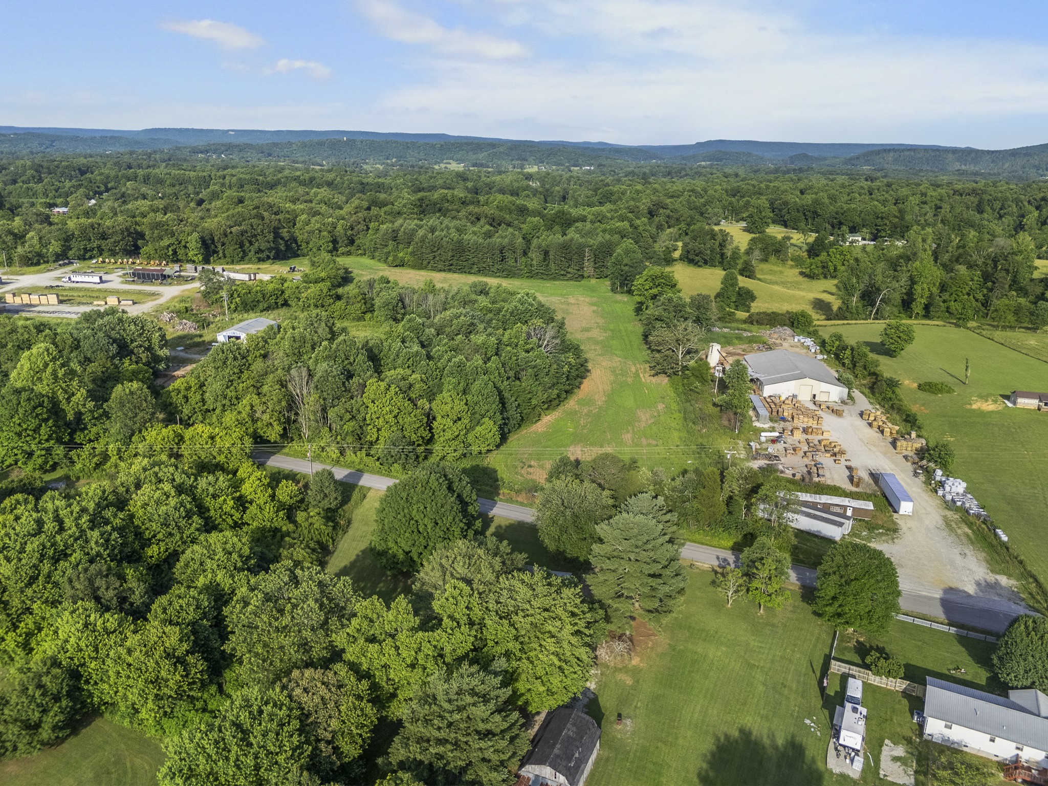 2502 Sullivan Knowles Road Sparta, TN 38583 - Photo 29 of 45 an aerial view of residential houses with outdoor space and trees