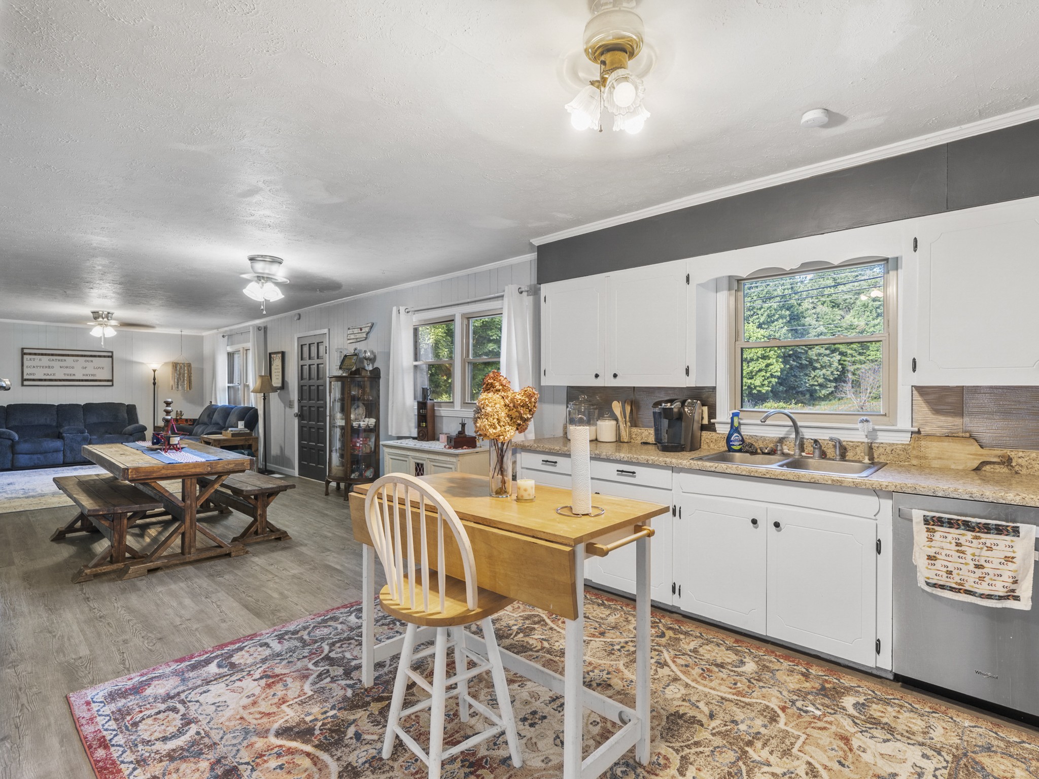 2502 Sullivan Knowles Road Sparta, TN 38583 - Photo 3 of 45 a very nice looking open dining room with kitchen island furniture a rug and a window