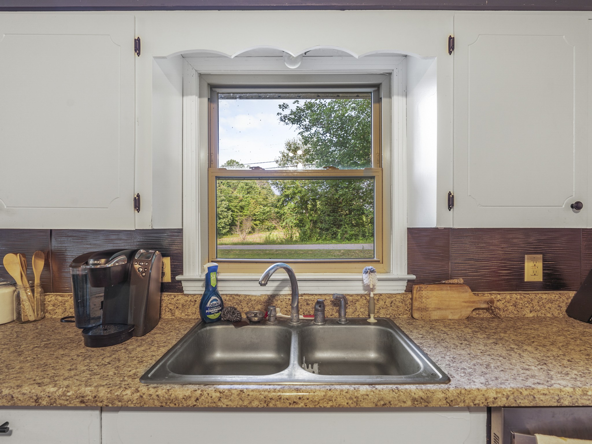 2502 Sullivan Knowles Road Sparta, TN 38583 - Photo 5 of 45 a kitchen with granite countertop a sink and a window
