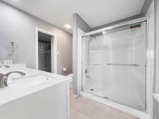 a bathroom with a sink and shower