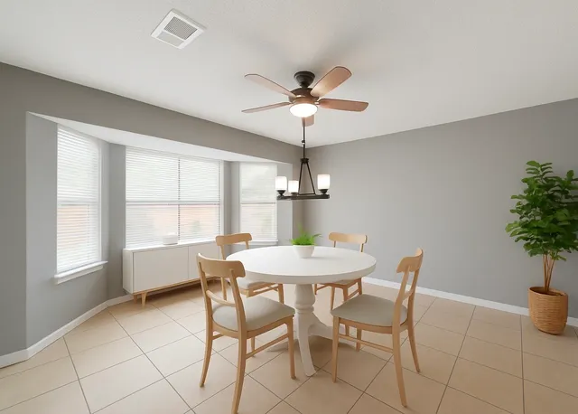 a dining room with furniture and window
