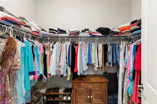 a view of a livingroom with workspace and a couch