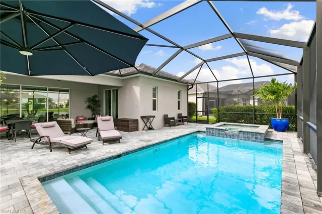 a view of swimming pool with a sitting area