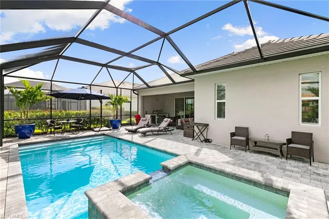 a view of a lake with houses in the back
