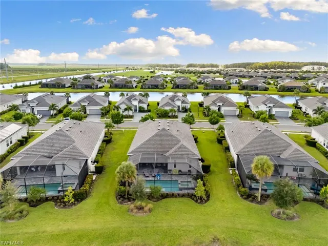 a view of a swimming pool with an outdoor seating
