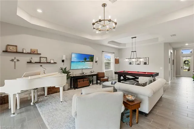 a kitchen with a center island appliances and cabinets