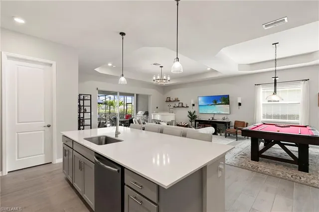 a kitchen with a sink stove and refrigerator