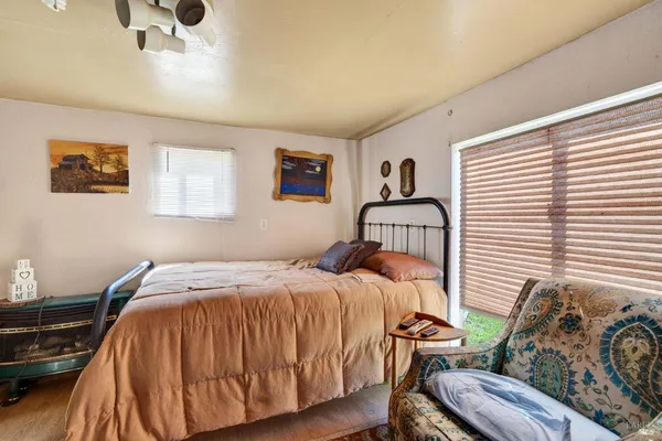 an aerial view of a house with an outdoor space