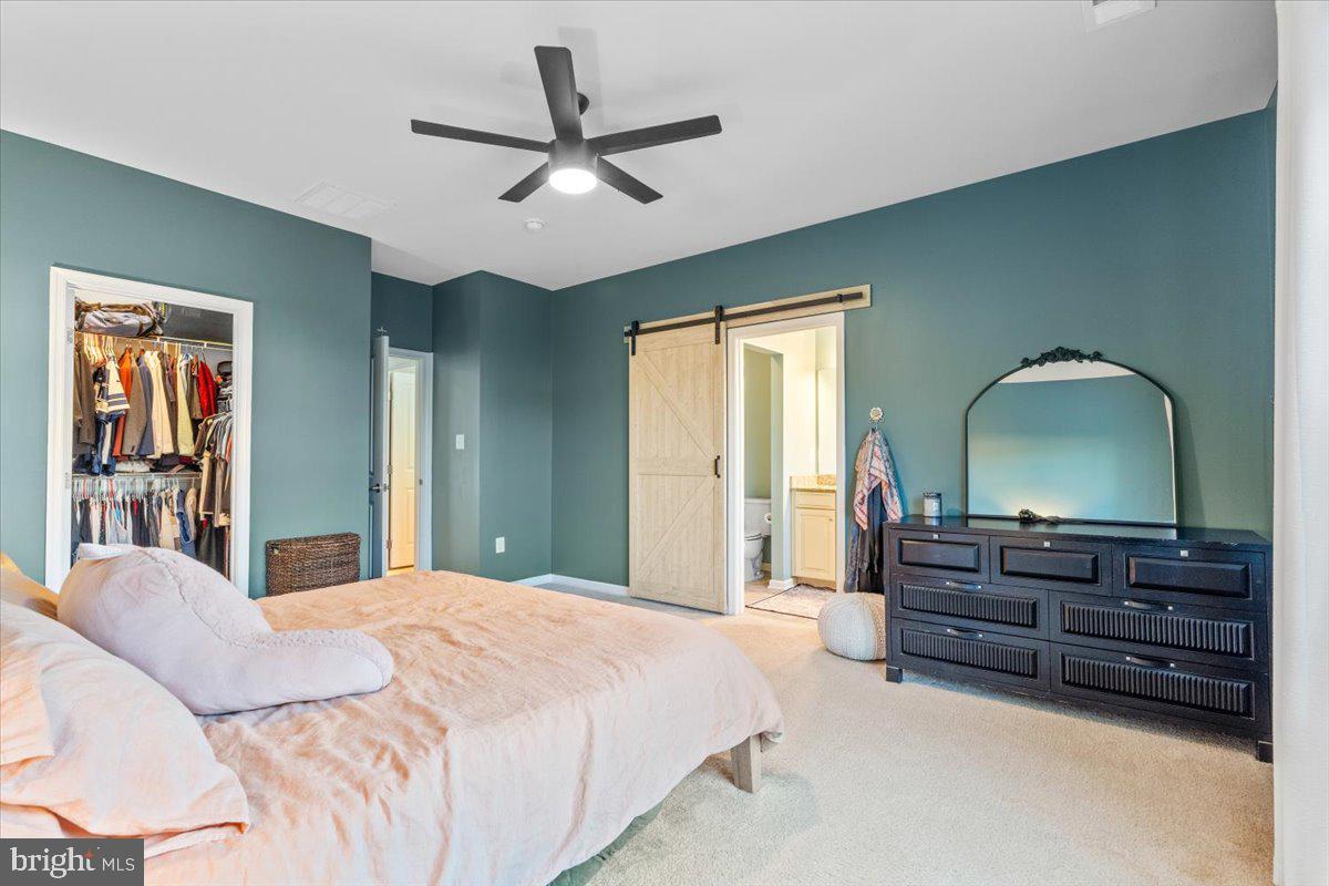 4535 Tinder Monrovia, MD 21770 - Photo 22 of 61 a bedroom with a bed and a dresser