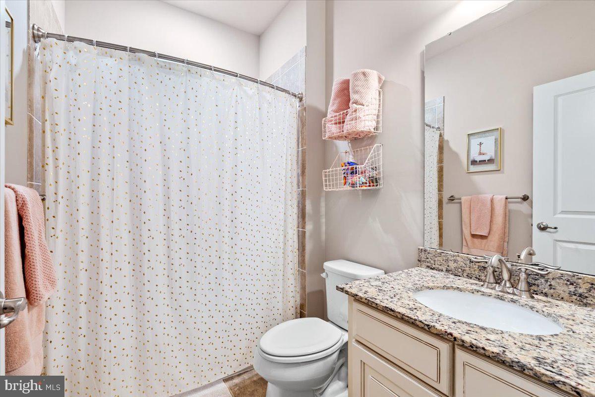 4535 Tinder Monrovia, MD 21770 - Photo 28 of 61 a bathroom with a granite countertop sink and a mirror