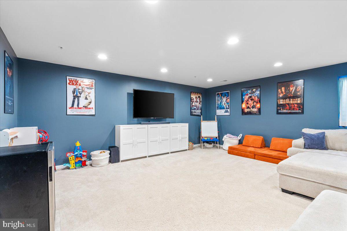 4535 Tinder Monrovia, MD 21770 - Photo 36 of 61 a living room with furniture and a flat screen tv