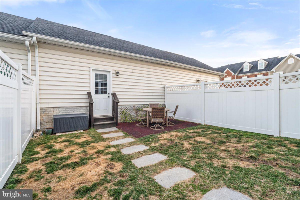 4535 Tinder Monrovia, MD 21770 - Photo 39 of 61 a backyard of a house with table and chairs