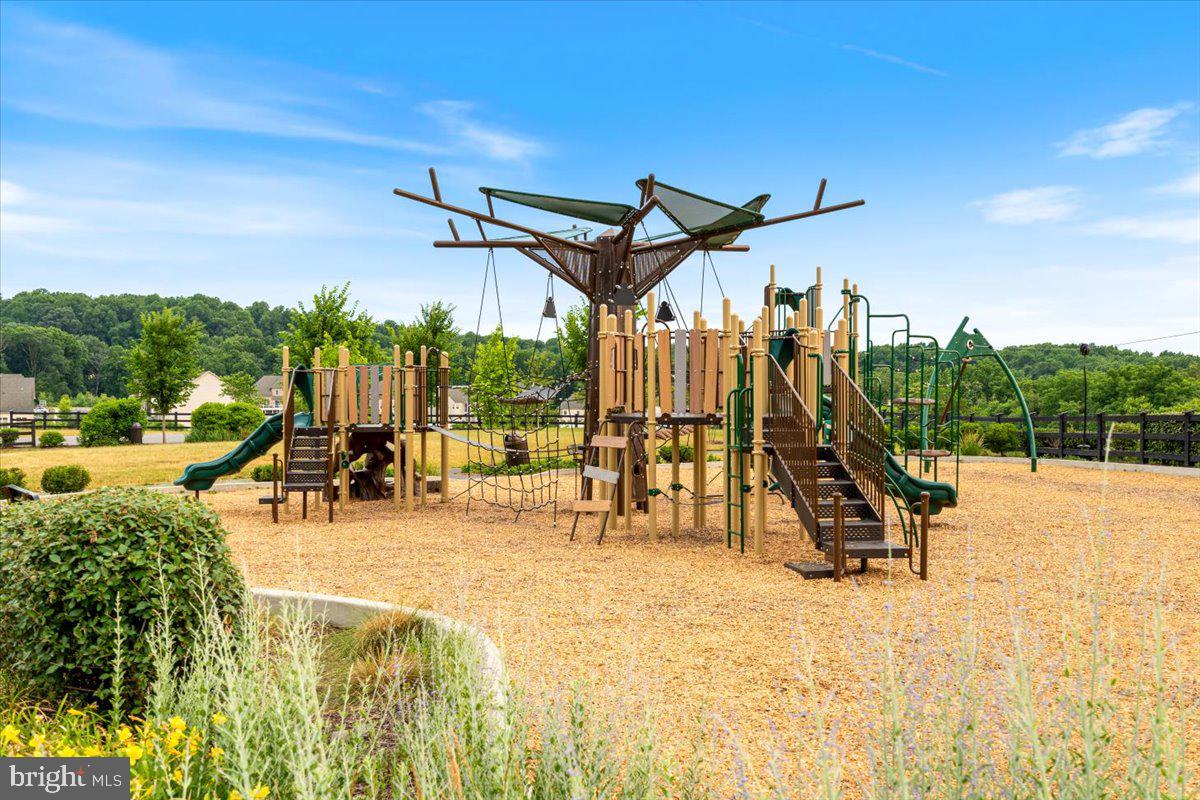 4535 Tinder Monrovia, MD 21770 - Photo 47 of 61 a view of a swimming pool with a bench and lawn chairs