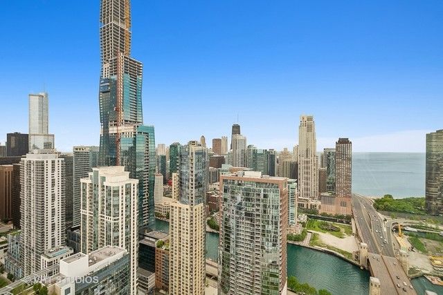 a view of city with a tall building