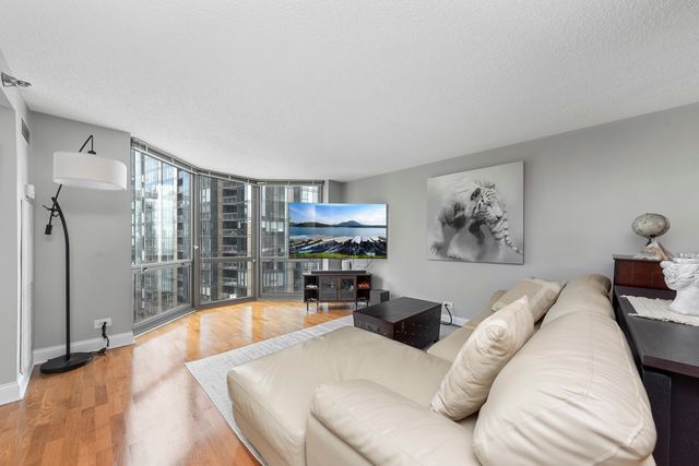 a large bedroom with a large bed and a couch