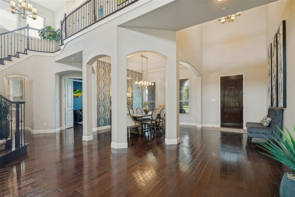 388 Bethany Road Sunnyvale, TX 75182 - Photo 7 of 40 Grand entryway featuring dark pre engineered wood-finish flooring and a two-story ceiling