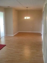 100 Cove Way, Unit 306 Quincy, MA 02169 - Photo 8 of 21 a view of empty room with wooden floor