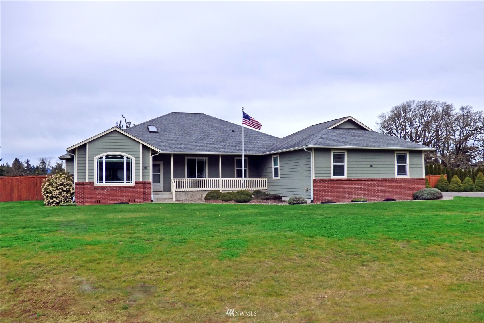 9606 185th Avenue Southwest Rochester, WA 98579 - Photo 4 of 40 a front view of a house with a garden