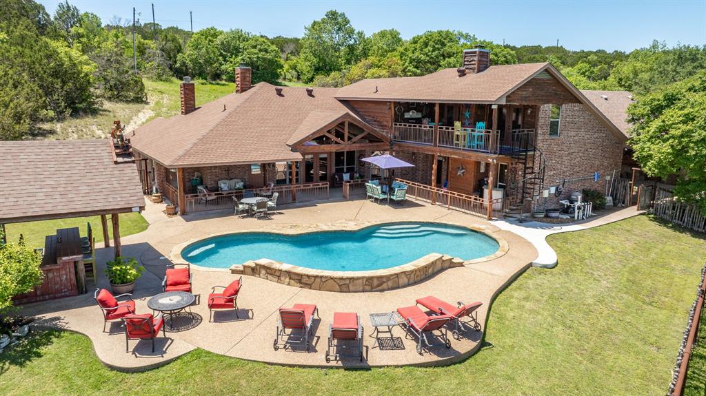 an aerial view of a house with outdoor space patio and entertaining space