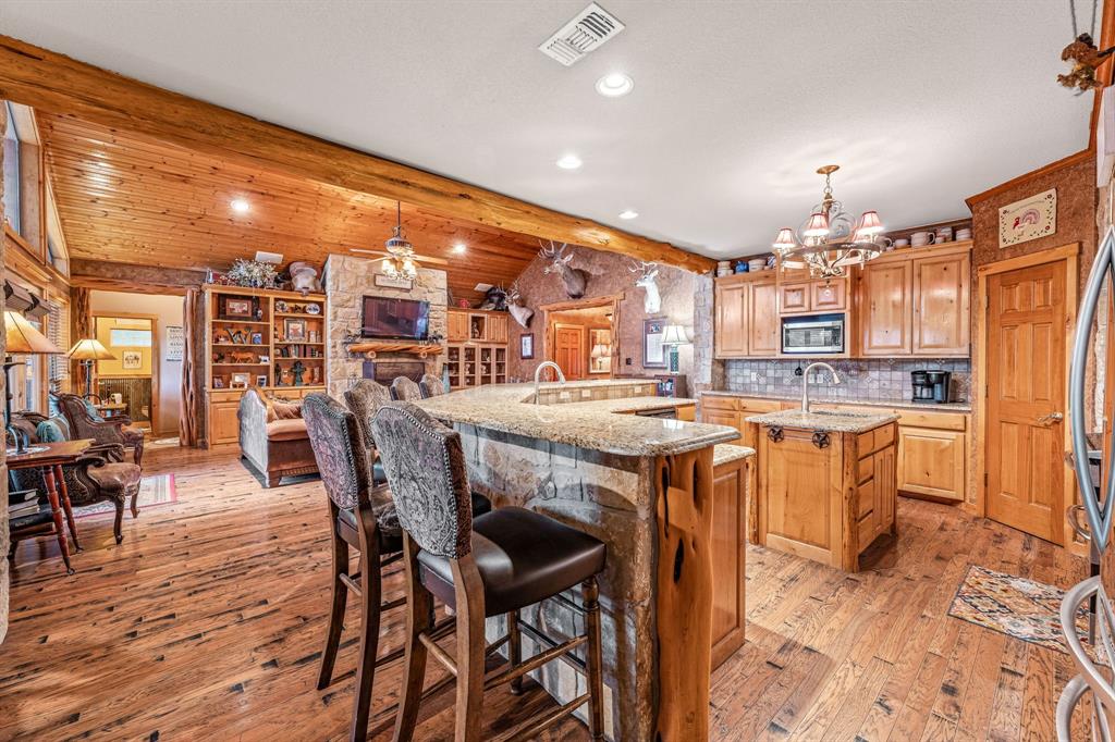 475 Magic Valley Bluff Dale, TX 76433 - Photo 12 of 40 a large kitchen with a table and chairs