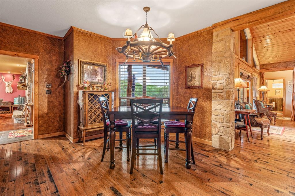 475 Magic Valley Bluff Dale, TX 76433 - Photo 13 of 40 a view of a dining room with furniture window and wooden floor