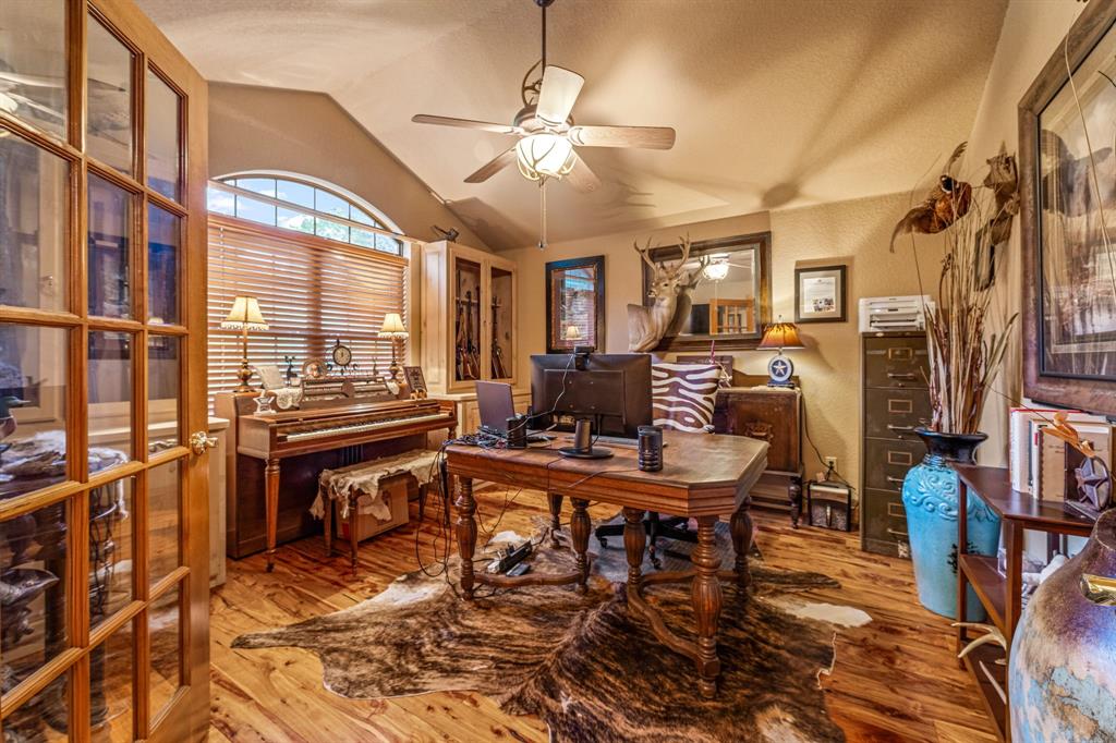 475 Magic Valley Bluff Dale, TX 76433 - Photo 14 of 40 a room with furniture a large window and a chandelier