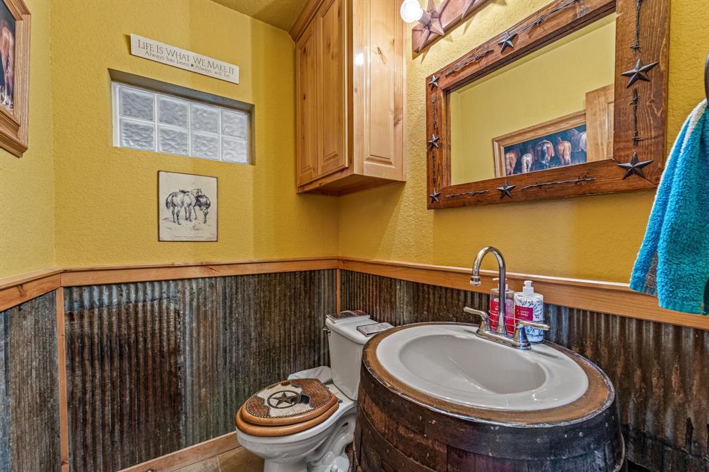 475 Magic Valley Bluff Dale, TX 76433 - Photo 15 of 40 a bathroom with a sink a toilet and a mirror
