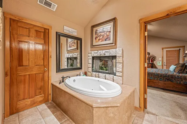 a en suite bathroom with a sink and a bathtub