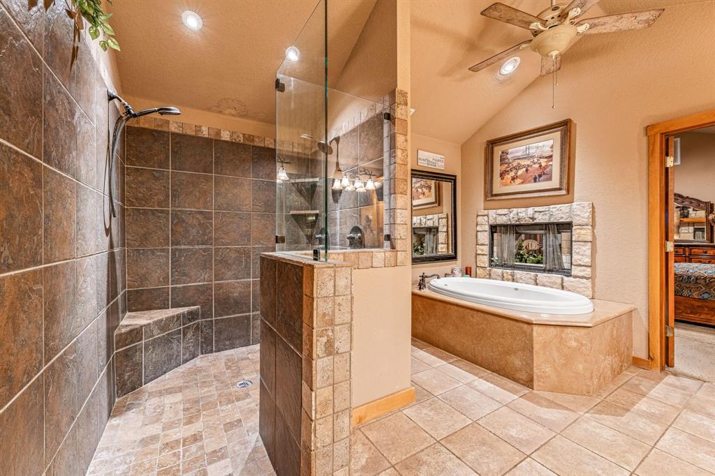 475 Magic Valley Bluff Dale, TX 76433 - Photo 18 of 40 a bathroom with a tub a sink and a shower