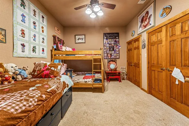 a bed room with furniture and a chandelier