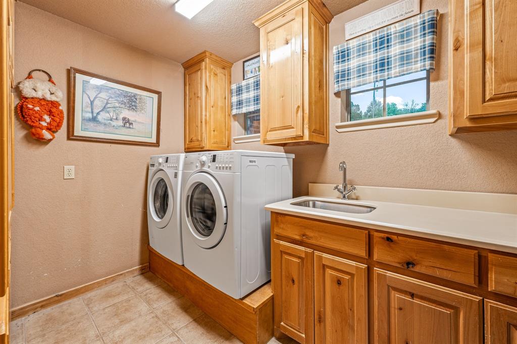 475 Magic Valley Bluff Dale, TX 76433 - Photo 24 of 40 a utility room with dryer and washer