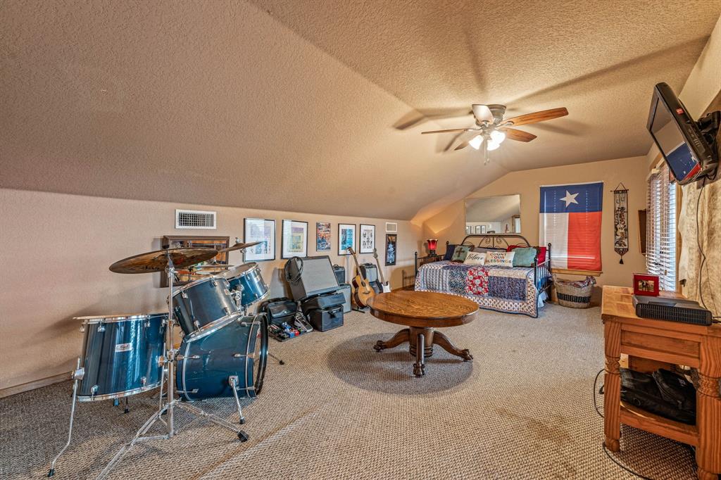 475 Magic Valley Bluff Dale, TX 76433 - Photo 25 of 40 a view of a room with gym equipment