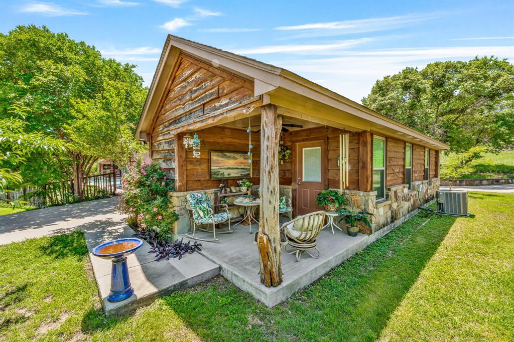 475 Magic Valley Bluff Dale, TX 76433 - Photo 38 of 40 a view of a backyard with sitting area and garden