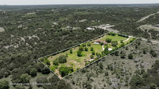 an aerial view of houses with yard